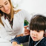 An audiologist studying a child&#39;s hearing