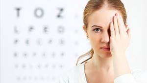 Girl checking her eyesight